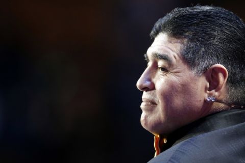 Argentine soccer legend Diego Maradona stands on stage during the 2018 soccer World Cup draw in the Kremlin in Moscow, Friday Dec. 1, 2017. (AP Photo/Alexander Zemlianichenko)