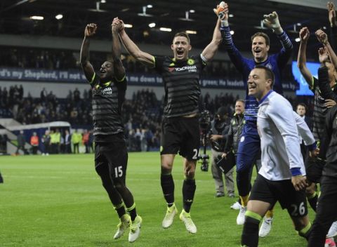 Chelsea's captain Gary Cahill, second left, celebrates with team mates after the English Premier League soccer match between West Bromwich Albion and Chelsea, at the Hawthorns in West Bromwich, England, Friday, May 12, 2017. Chelsea won the match 0-1 meaning they win the Premiership title. (AP Photo/Rui Vieira)