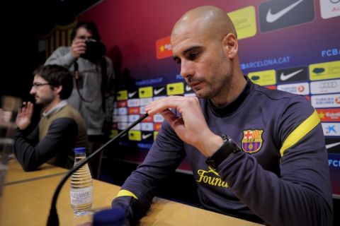 FC Barcelona's coach Pep Guardiola prepares for a press conference at the Camp Nou stadium in Barcelona on January 24, 2012, on the eve of the Spanish Cup "El clasico" football match between Barcelona and Real Madrid.  AFP PHOTO / JOSEP LAGO (Photo credit should read JOSEP LAGO/AFP/Getty Images)