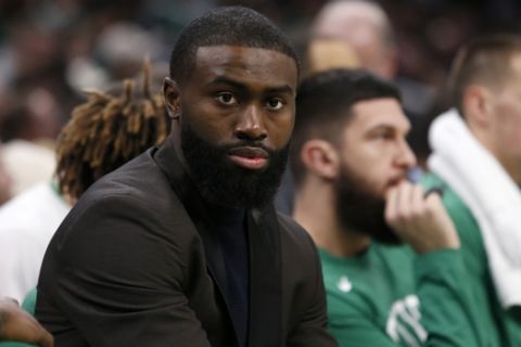 Boston Celtics guard Jaylen Brown looks on from the bench during the second half of an NBA basketball game against the Phoenix Suns, Saturday, Jan. 18, 2020, in Boston. (AP Photo/Mary Schwalm)