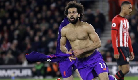 Liverpool's Mohamed Salah celebrates after scoring his side's second goal during the English Premier League soccer match between Southampton and Liverpool at St Mary's stadium in Southampton, England Friday, April 5, 2019. (AP Photo/Kirsty Wigglesworth)