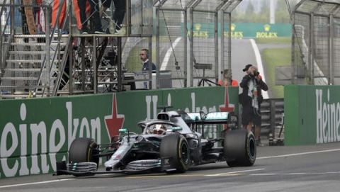 Mercedes driver Lewis Hamilton of Britain drives past the checkered flag to win the Chinese Formula One Grand Prix at the Shanghai International Circuit in Shanghai on Sunday, April 14, 2019. (AP Photo/Ng Han Guan)