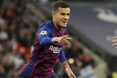 Barcelona forward Philippe Coutinho celebrates after scoring his sides first goal during the Champions League Group B soccer match between Tottenham Hotspur and Barcelona at Wembley Stadium in London, Wednesday, Oct. 3, 2018. (AP Photo/Frank Augstein)