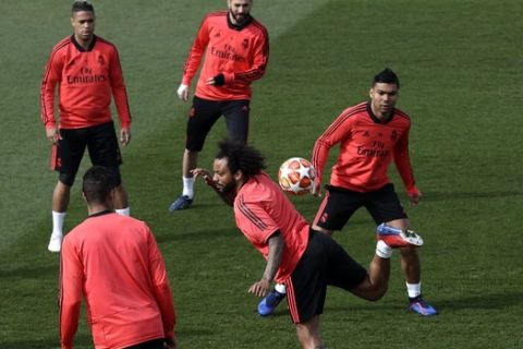 Real Madrid's Marcelo controls the ball during a training session at the team's Valdebebas training ground in Madrid, Spain, Monday, March 4, 2019. Real Madrid will play against Ajax in a Champions League soccer match on Tuesday. (AP Photo/Manu Fernandez)