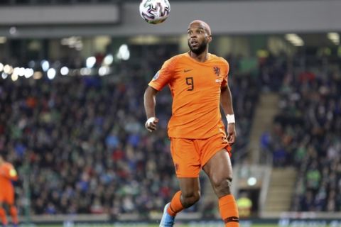 Netherlands' Ryan Babel eyes the ball during the Euro 2020 group C qualifying soccer match between Northern Ireland and the Netherlands at Windsor Park, Belfast, Northern Ireland, Saturday, Nov. 16, 2019. (AP Photo/Peter Morrison)