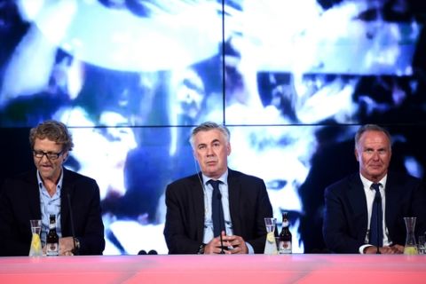 Munich's new head coach Carlo Ancelotti , center, speaks next to FC Bayern Munich CEO Karl-Heinz Rummenigge, right,   and spokesman Dieter Nickles  during a press conference held at the Allianz Arena in Munich, Germany,  Monday. July 11,  2016.  (Matthias Balk/dpa via AP)