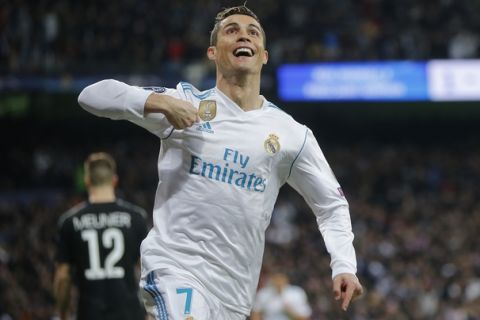 Real Madrid's Cristiano Ronaldo celebrates his side's 2nd goal during the Champions League soccer match, round of 16, 1st leg between Real Madrid and Paris Saint Germain at the Santiago Bernabeu stadium in Madrid, Spain, Wednesday, Feb. 14, 2018. (AP Photo/Paul White)