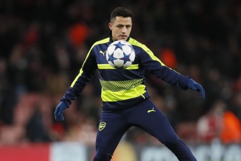 Arsenal's Alexis Sanchez controls the ball prior to the start of the Champions League round of 16 second leg soccer match between Arsenal and Bayern Munich at the Emirates Stadium in London, Tuesday, March 7, 2017. (AP Photo/Kirsty Wigglesworth)