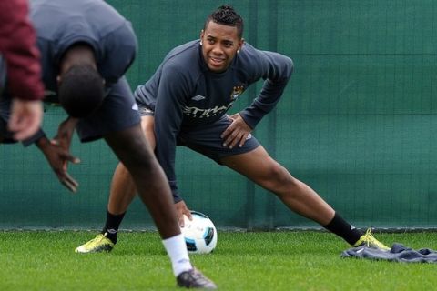 Manchester City's Brazilian forward Robinho stretches during a team training session at their training ground in Manchester, north-west England, on August 25, 2010.    Manchester City are set to play FC Timisoara in their UEFA Europa League fixture on Thursday.     AFP PHOTO/PAUL ELLIS (Photo credit should read PAUL ELLIS/AFP/Getty Images)