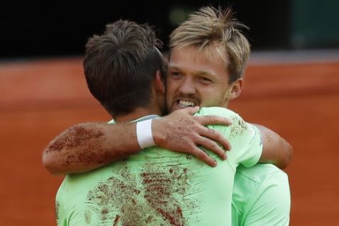 Germany's Kevin Krawietz, right, and Andreas Mies, left, celebrate winning the men's doubles final match of the French Open tennis tournament against France's Jeremy Chardy and Fabrice Martin at the Roland Garros stadium in Paris, Saturday, June 8, 2019. (AP Photo/Pavel Golovkin)