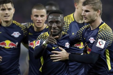 Leipzig's scorer Naby Keita, 2nd right, and his teammates celebrate the opening goal during the German Bundesliga soccer match between Hamburger SV and RB Leipzig in Hamburg, Germany, Friday, Sept. 8, 2017. (AP Photo/Michael Sohn)