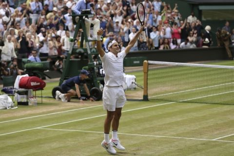 2017 AP YEAR END PHOTOS - Switzerland's Roger Federer celebrates after defeating Croatia's Marin Cilic to win the Men's Singles final match on day thirteen at the Wimbledon Tennis Championships in London on July 16, 2017. (AP Photo/Tim Ireland)