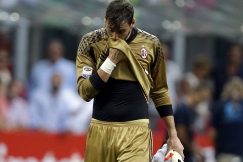 AC Milan goalkeeper Gianluigi Donnarumma leaves the pitch at the end of the Serie A soccer match between AC Milan and Torino at the San Siro stadium in Milan, Italy, Sunday, Aug. 21, 2016. AC Milan won 3-2 and Donnaruma saved a penalty kick. (AP Photo/Antonio Calanni)