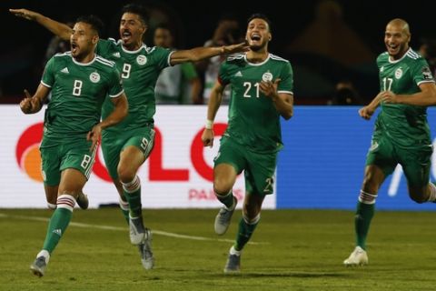 Algerian players celebrate after a goal during the African Cup of Nations group C soccer match between Algeria and Senegal at 30 June Stadium in Cairo, Egypt, Thursday, June 27, 2019. (AP Photo/Ariel Schalit)