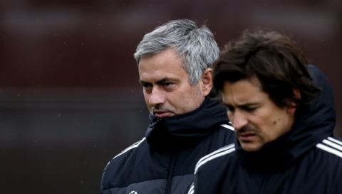 Chelsea manager Jose Mourinho, left, and assistant first team coach Rui Faria, arrive for the team's training session at Cobham training ground, in Cobham, England, Tuesday, Nov. 5, 2013 ahead of their Champions League group soccer match against Schalke on Wednesday. (AP Photo/Lefteris Pitarakis)