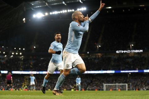 Manchester City's David Silva celebrates scoring his side's second goal of the game during the English Premier League soccer match between Manchester City and West Ham at the Etihad Stadium in, Manchester, England, Sunday Dec. 3, 2017. (Martin Rickett/PA via AP)