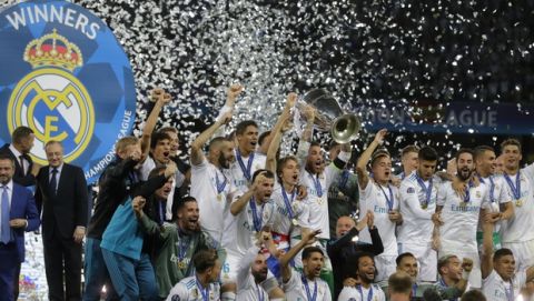 Real Madrid's Sergio Ramos lifts the trophy after winning the Champions League Final soccer match between Real Madrid and Liverpool at the Olimpiyskiy Stadium in Kiev, Ukraine, Saturday, May 26, 2018. (AP Photo/Efrem Lukatsky)