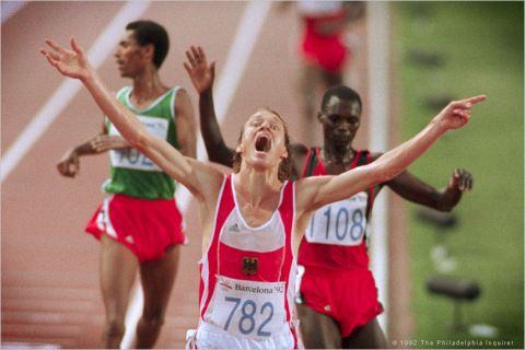 Dieter Baumann reacts to winning the men's 5,000 meter run during the 1992 Barcelona Olympics. Photo by Jerry Lodriguss / The Philadelphia Inquirer