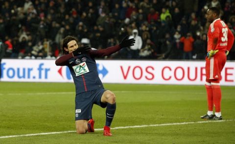 PSG's Edinson Cavani celebrates after scoring his side's third goal during the French Cup soccer match between Paris Saint-Germain and Marseille at the Parc des Princes Stadium, in Paris, France, Wednesday, Feb. 28, 2018. (AP Photo/Thibault Camus)