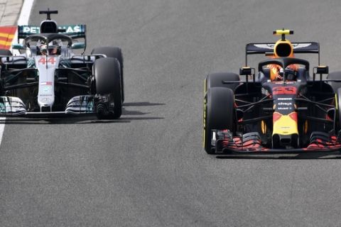 Red Bull driver Max Verstappen of the Netherlands, right, leads Mercedes driver Lewis Hamilton of Britain during the first practice session ahead of the Belgian Formula One Grand Prix in Spa-Francorchamps, Belgium, Friday, Aug. 24, 2018. (AP Photo/Geert Vanden Wijngaert)