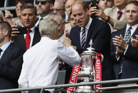 Arsenal team manager Arsene Wenger, center left, talks with Britain's Prince William after winning the English FA Cup final soccer match between Arsenal and Chelsea at Wembley stadium in London, Saturday, May 27, 2017. Arsenal won 2-1. (AP Photo/Kirsty Wigglesworth)