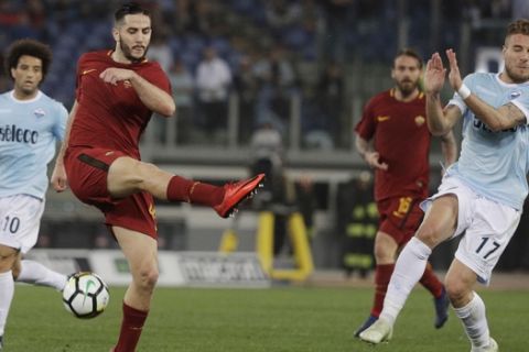 Lazio's Ciro Immobile, right, and Roma's Kostas Manolas vie for the ball during an Italian Serie A soccer match between AS Roma and Lazio, at the Olympic stadium in Rome, Sunday, April 15, 2018. (AP Photo/Gregorio Borgia)
