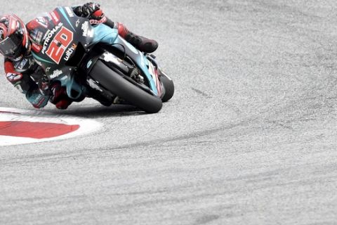 France's rider Fabio Quartararo of the Petronas Yamaha SRT steers his motorcycle during the MotoGP race at the Austrian motorcycle Grand Prix at the Red Bull Ring in Spielberg, Austria, Sunday, Aug. 11, 2019. (AP Photo/Kerstin Joensson)