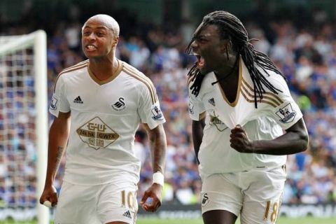 Bafetimbi Gomis of Swansea celebrates scoring his sides second goal with team-mate  Andre Ayew of Swansea   