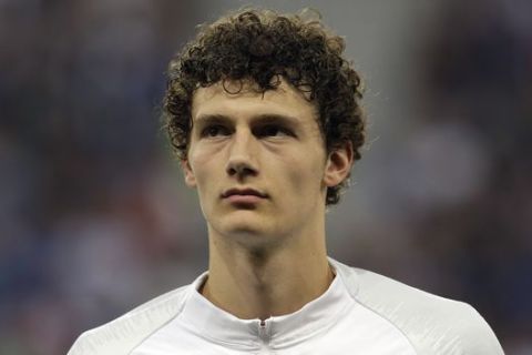 France's Benjamin Pavard listens to the national anthems before a friendly soccer match between France and Italy at the Allianz Riviera stadium in Nice, southern France, Friday, June 1, 2018. (AP Photo/Claude Paris)