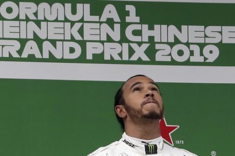 Mercedes driver Lewis Hamilton of Britain looks during the award ceremony for the Chinese Formula One Grand Prix at the Shanghai International Circuit in Shanghai on Sunday, April 14, 2019. (AP Photo/Ng Han Guan)