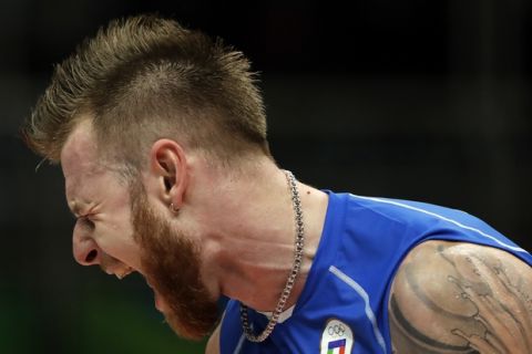 Italy's Ivan Zaytsev reacts during a men's preliminary volleyball match against Brazil at the 2016 Summer Olympics in Rio de Janeiro, Brazil, Saturday, Aug. 13, 2016. (AP Photo/Matt Rourke)