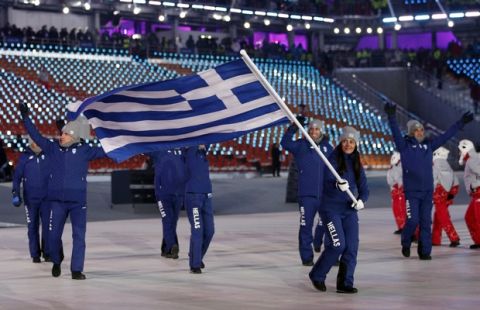 Sophia Ralli carries the flag of Greece during the opening ceremony of the 2018 Winter Olympics in Pyeongchang, South Korea, Friday, Feb. 9, 2018. (AP Photo/Jae C. Hong)