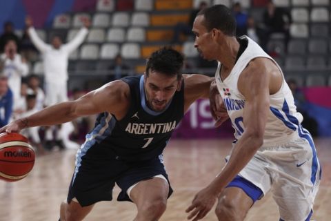 Facundo Campazzo of Argentina, left, challenges Adris De Leon of Dominican Republic during men's basketball preliminary round match at the Pan American Games in Lima, Peru, Thursday, Aug. 1, 2019. (AP Photo/Juan Karita)