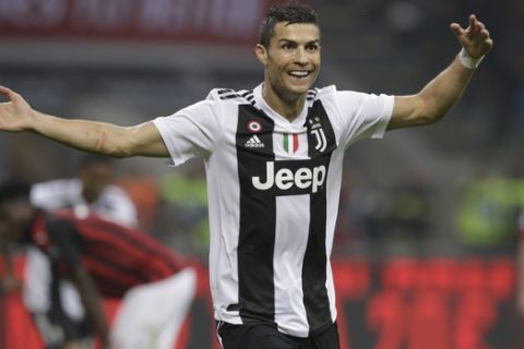 FILE - In this Nov. 11, 2018 file photo, Juventus' Cristiano Ronaldo celebrates after he scored his side's second goal during a Serie A soccer match between AC Milan and Juventus, at Milan's San Siro stadium, Italy. Inter Milan is heading to Juventus determined to prove the battle for the Serie A title is not already over. Inter is third but already 11 points behind Juventus and anything but a win Friday, Dec. 7, 2018, against the Serie A leader in Turin will surely rule the Nerazzurri out of the title race.  (AP Photo/Luca Bruno, file)