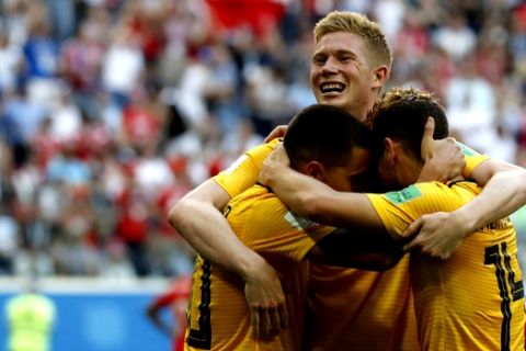 Belgium's Kevin De Bruyne, face to camera, and Belgium's Dries Mertens, right, celebrate with Belgium's Eden Hazard after Hazard scored his side's second goal during the third place match between England and Belgium at the 2018 soccer World Cup in the St. Petersburg Stadium in St. Petersburg, Russia, Saturday, July 14, 2018. (AP Photo/Petr David Josek)