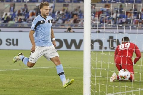 Lazio's Ciro Immobile celebrates after scoring his side's opening goal on a penalty kick during a Serie A soccer match between Lazio and Fiorentina at Rome's Olympic stadium, Saturday, June 27, 2020. (AP Photo/Riccardo de Luca)