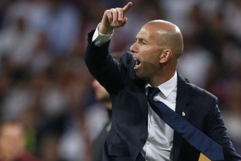 Real Madrid's head coach Zinedine Zidane gives instructions to his players during the Champions League semifinal first leg soccer match between Real Madrid and Atletico Madrid at the Santiago Bernabeu stadium in Madrid, Spain, Tuesday, May 2, 2017. (AP Photo/Francisco Seco)