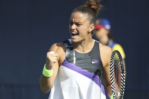 Maria Sakkari, of Greece, reacts after a shot to Camila Giorgi, of Italy, during the first round of the US Open tennis tournament Monday, Aug. 26, 2019, in New York. (AP Photo/Michael Owens)