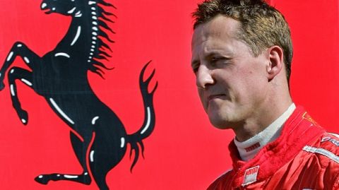 Germany's Michael Schumacher walks through the pit area before a test session in his Ferrari Formula One motor racing car at the Jerez racetrack, in Jerez, southern Spain, Wednesday, Oct. 11, 2006. (AP Photo/Javier Barbancho)