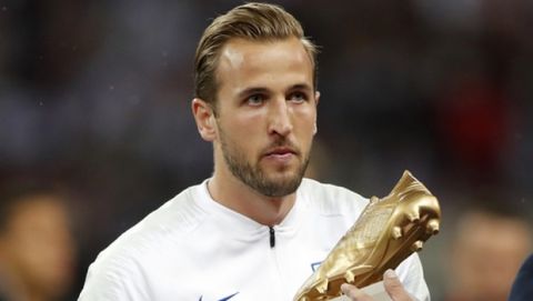 England manager Gareth Southgate hands England's Harry Kane his World Cup Golden Boot before the UEFA Nations League soccer match between England and Spain at Wembley stadium in London, Saturday Sept. 8, 2018. (AP Photo/Frank Augstein)