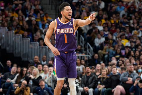 Phoenix Suns guard Devin Booker celebrates late in the second half of an NBA basketball game against the Denver Nuggets Thursday, March 24, 2022, in Denver. (AP Photo/David Zalubowski)














