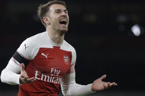 Arsenal's Aaron Ramsey celebrates after scoring his side's third goal during the English Premier League soccer match between Arsenal and Fulham at Emirates stadium in London, Tuesday, Jan. 1, 2019. (AP Photo/Kirsty Wigglesworth)