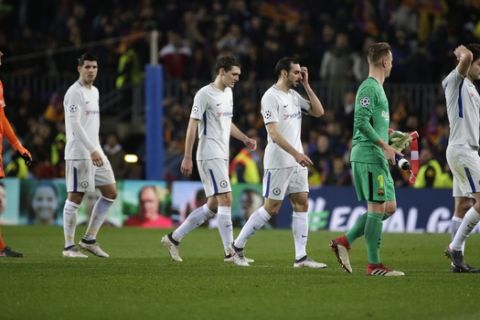 Chelsea goalkeeper Thibaut Courtois, left, and his teammates react to their elimination during the Champions League round of sixteen second leg soccer match between FC Barcelona and Chelsea at the Camp Nou stadium in Barcelona, Spain, Wednesday, March 14, 2018. (AP Photo/Emilio Morenatti)