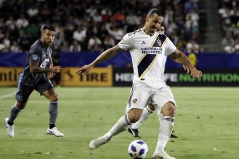 LA Galaxy forward Zlatan Ibrahimovic crosses the ball during the second half of the team's MLS soccer match against the Minnesota United on Saturday, Aug. 11, 2018, in Carson, Calif. (AP Photo/Marcio Jose Sanchez)