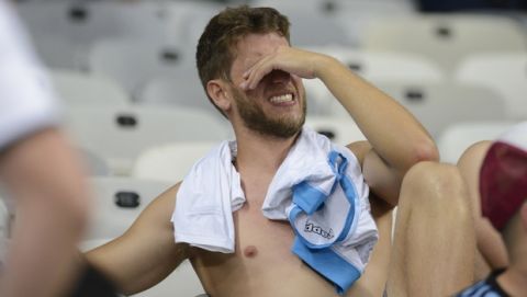 An Argentina fan cries in the stands after his team lost 2-0 to Brazil in a Copa America semifinal soccer match at Mineirao stadium in Belo Horizonte, Brazil, Tuesday, July 2, 2019. (AP Photo/Eugenio Savio)