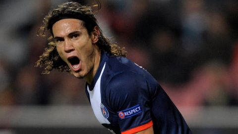 PSG's Uruguayan forward Edinson Cavani celebrates after scoring a goal during the UEFA Champions League Group C football match SL Benfica vs Paris Saint-Germain at the Luz stadium in Lisbon on December 10, 2013.   AFP PHOTO/ MIGUEL RIOPA        (Photo credit should read MIGUEL RIOPA/AFP/Getty Images)