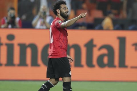 Egypt's Mohamed Salah reacts after he scored during the group A soccer match between Egypt and DR Congo at the Africa Cup of Nations at Cairo International Stadium in Cairo, Egypt, Wednesday, June 26, 2019. (AP Photo/Hassan Ammar)