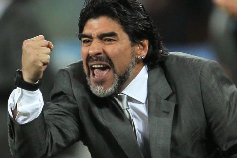 JOHANNESBURG, SOUTH AFRICA - JUNE 27:  Diego Maradona head coach of Argentina celebrates after  Gonzalo Higuain scores his side's second goal during the 2010 FIFA World Cup South Africa Round of Sixteen match between Argentina and Mexico at Soccer City Stadium on June 27, 2010 in Johannesburg, South Africa.  (Photo by Chris McGrath/Getty Images) *** Local Caption *** Diego Maradona