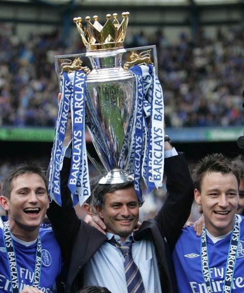 FILE -  A Saturday, May 7, 2005 photo from files showing Chelsea FC manager Jose Mourinho celebrating the FA Premiership trophy with Frank Lampard, left, and John Terry, after winning the English Premiership League at Stamford Bridge in London.  Jose Mourinho is officially returning to Chelsea as the London club's new manager, six years after his acrimonious departure. Chelsea confirmed Monday, June 3, 2013 that the 50-year-old Mourinho was hired on a four-year contract after completing a three-year stint at Real Madrid, where his final season ended without a trophy. Madrid released the Portuguese coach from his contract a year early, so Chelsea owner Roman Abramovich will not have to pay compensation to be re-united with the manager he fell out with in 2007. (AP Photo/Alastair Grant, File) 