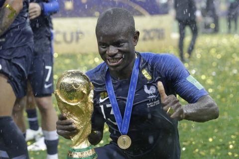France's Ngolo Kante celebrates with the trophy after the final match between France and Croatia at the 2018 soccer World Cup in the Luzhniki Stadium in Moscow, Russia, Sunday, July 15, 2018. France won the final 4-2. (AP Photo/Matthias Schrader)